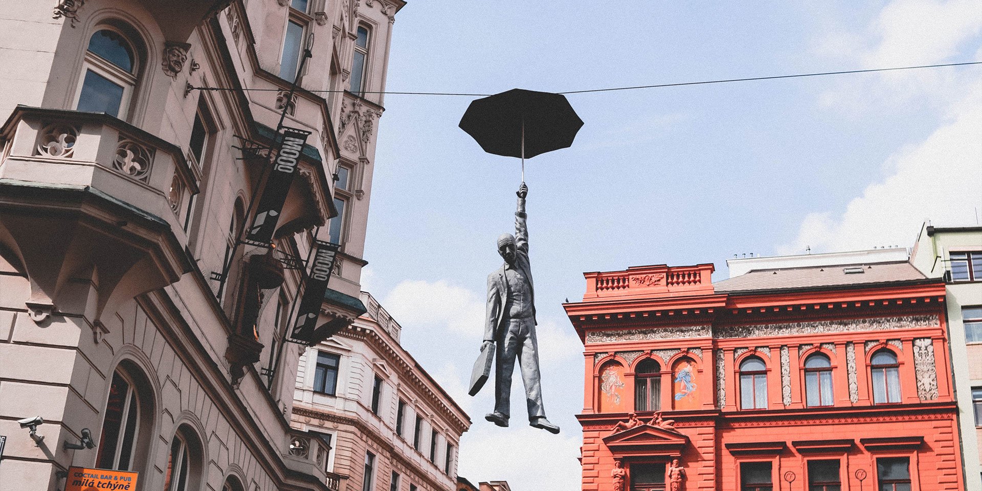 man with an umbrella in prague