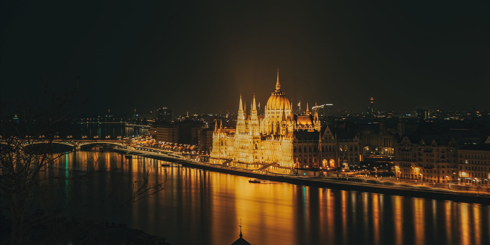 See the prague parliament building from the Danube on your central europe tour.